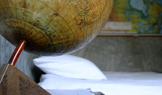 A globe and bed in the Map Room